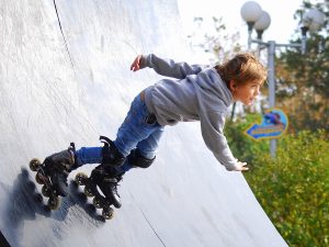 boy inline skating on ramp